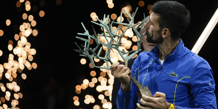 Serbia's Novak Djokovic kisses the trophy after winning the final match against Bulgaria's Grigor Dimitrov at the Paris Masters tennis tournament Sunday, Nov. 5, 2023.